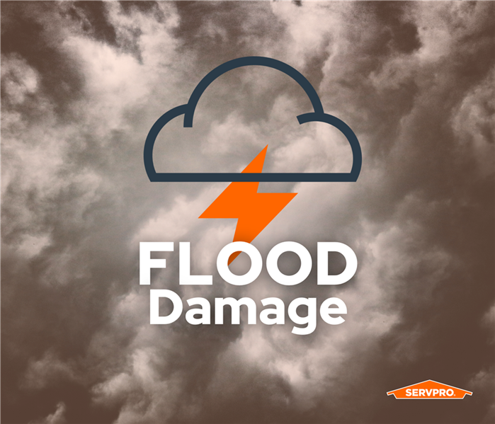 dark, gray, storm clouds, SERVPRO storm logo with the words flood damage on top