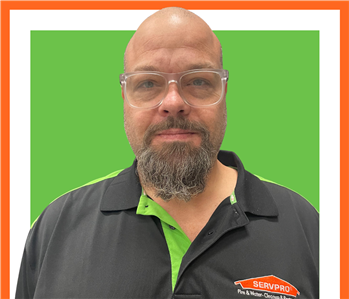 Jose, servpro employee against a green background, man